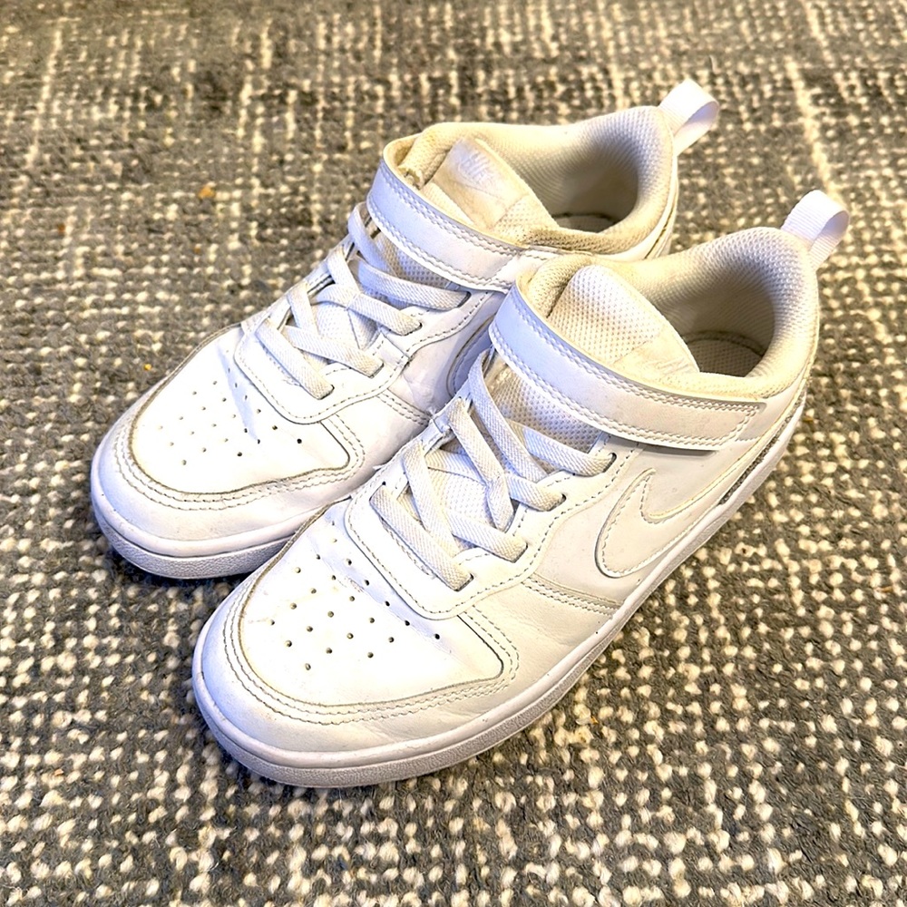 Boys Velcro close Nike sneakers